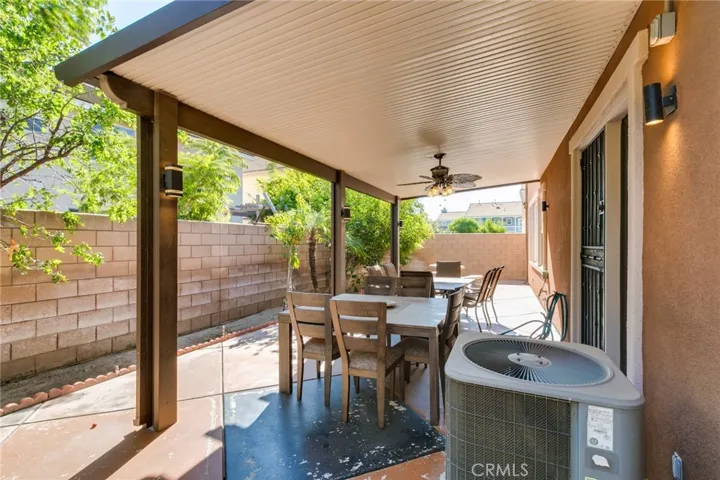 Patio with ceiling fan and light fixtures