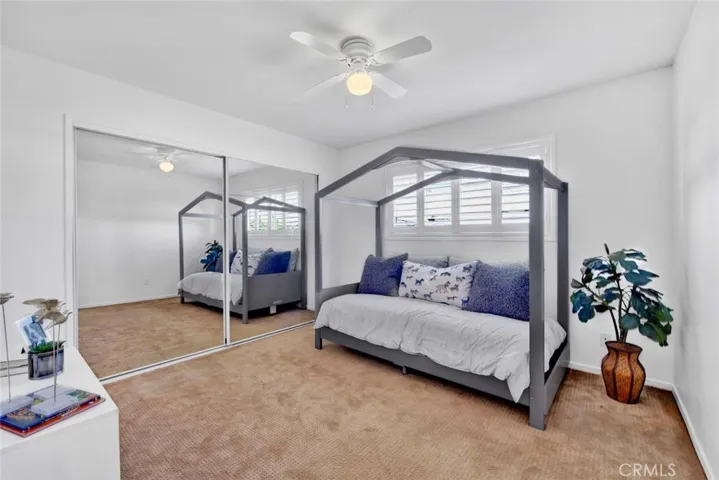 Good-Sized Bedroom that includes small sitting area