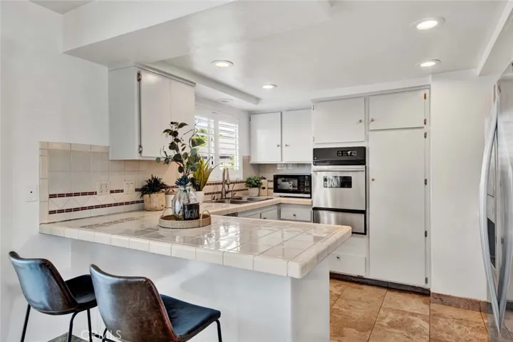 Remolded Kitchen has plenty of cabinet and counter space. Upgraded/Turnkey Ready