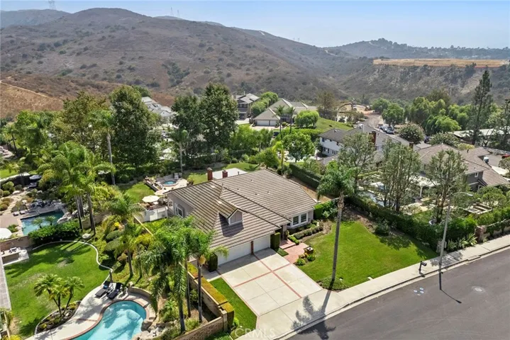 Bird's eye view allows you to appreciate this beautiful executive level home. With 4 bedrooms and 2 baths and a gracious lot size of 15,000 sq ft, your home will be the "gathering place."