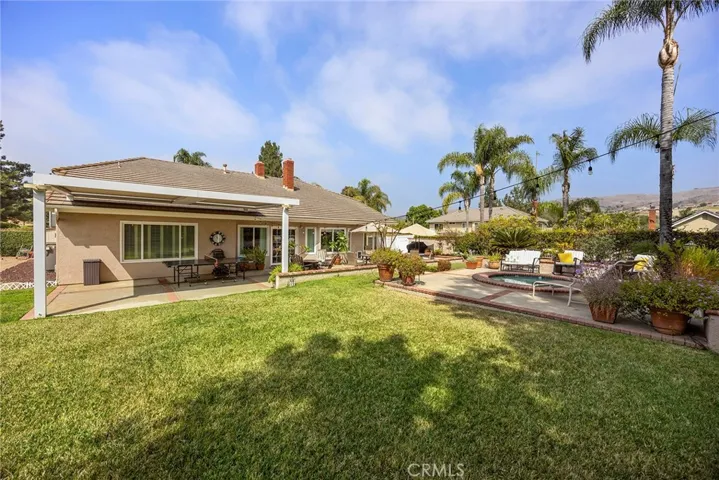 This view of backyard shows how expansive this lot is. Large enough to put in a pool. Right now it is perfect for bounce house parties or to play ball.