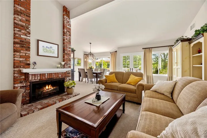 This living room will invite intimate chats, while still allowing for easy flow when entertaining. Note the French doors that invite you to the outdoors.