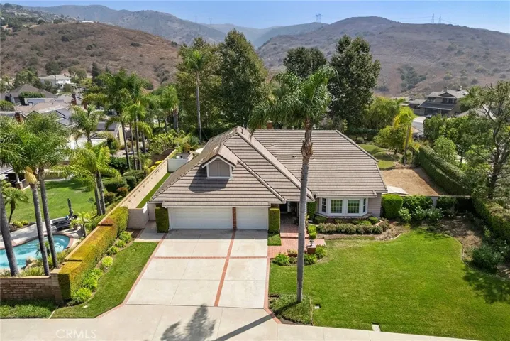 Nestled with picturesque hills as the backdrop, this home is as delightful as its surroundings. This charming single level home is located in Coventry Hills, an exclusive equestrian community. This is horse property, so you can keep your horse in your backyard. Notice the horse area on the right side of the backyard. The 3 car garage which will provide space for cars, toys, projects and hobbies.