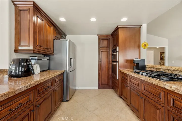 All the necessary ingredients for a gourmet kitchen are here: granite counters, 4 burner gas range, stainless steel microwave and dual ovens, stainless steel sink and dishwasher, plenty of cabinet space for organization.