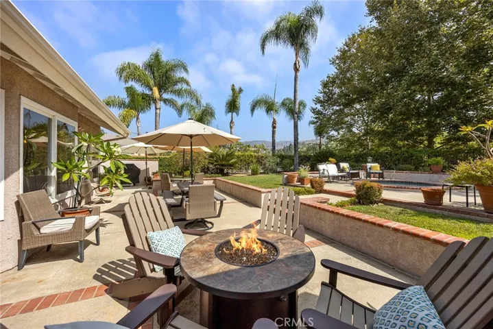 Newly hardscaped backyard includes patios with brick ribboning, brick seating areas, open patios and covered patio. It is plumbed for a gas barbeque.