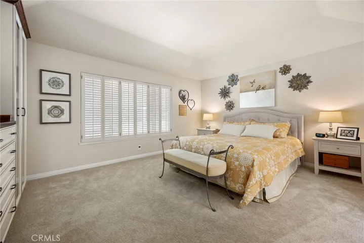 This primary bedroom is a calming and soothing space, like a restful retreat from the day.