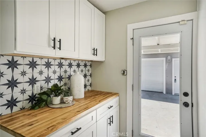 new cabinets, splash back tiles and new glass door