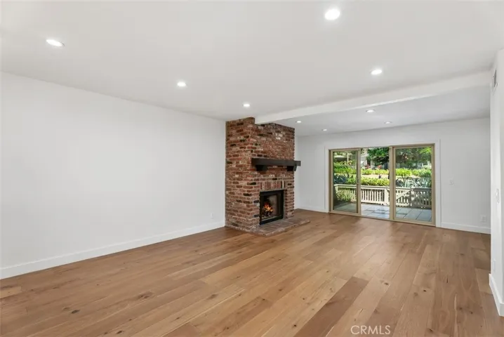 Living Area with Brick Gas Fireplace.