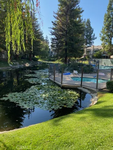 Less then a 1/2 of a block from the Home is this lovely Pool and Spa area that is surrounded by trees, Weeping Willow Trees, Lilly Pads, and the greenest grass.  So inviting to take a stop and take a quick dip in the pool or enjoy a few minutes in the spa in the pool and it is so inviting to stop and take a deep in the pool or relax in the spa