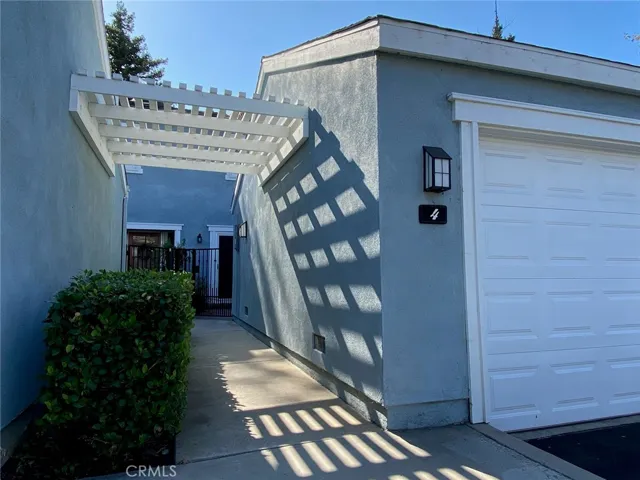 The Walkway to the entrance at the back of your Home.  Lights on the garage to guide you home.