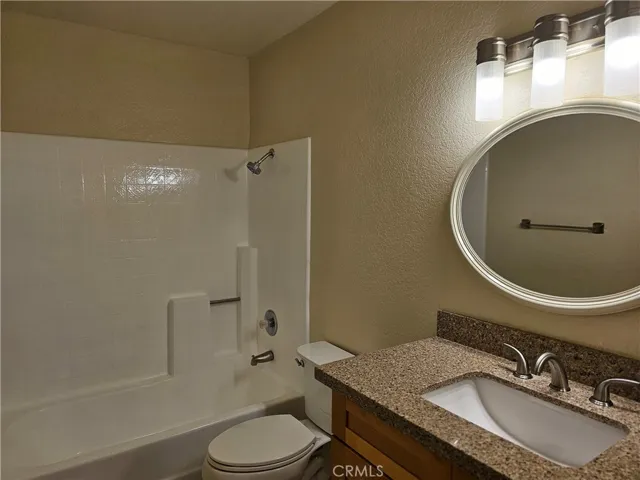 Full bathroom with upgraded Quartz countertops.