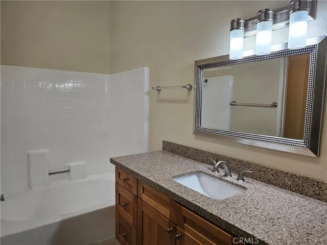Primary en suite bathroom with upgraded Quartz countertops.