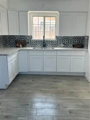 new quartz counter,cabinets and tile backsplash