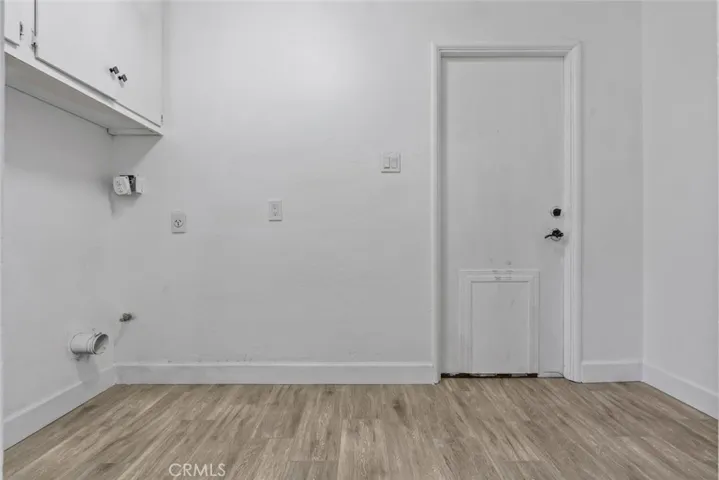 indoor laundry next to half bath and garage