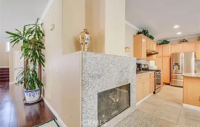 Fireplace just around the corner from Living Room and in the Dining Room/Kitchen space