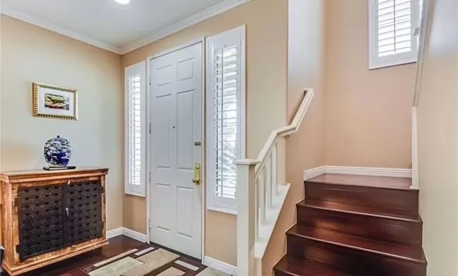 Front Door on left and Stairs to 2nd Level on the right