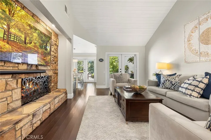 Fireplace Features Custom Stone & Lighting.