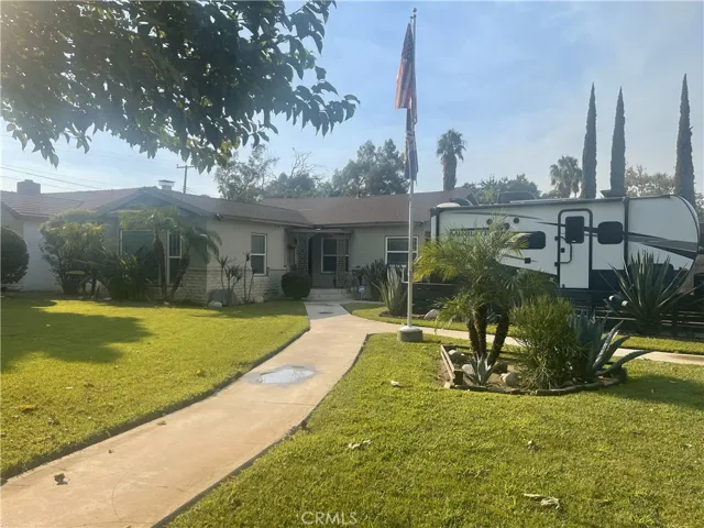 Exterior with large front yard and RV parking