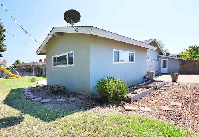 Wrap around yard and potential garden area outside the 4th bedroom