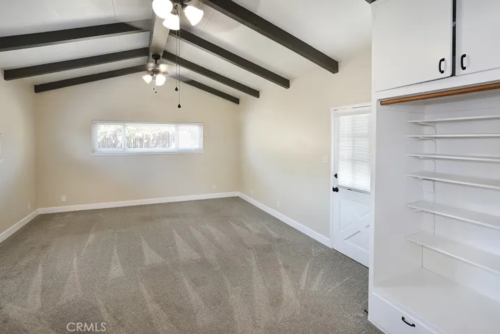 4th bedroom (2 separate closets) that sits on the opposite side of the home from the other bedrooms. Lots of privacy and accesses the large back patio and yard.