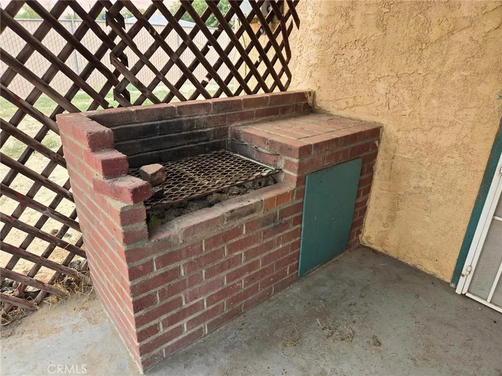 Built-in BBQ back house, front porch.
