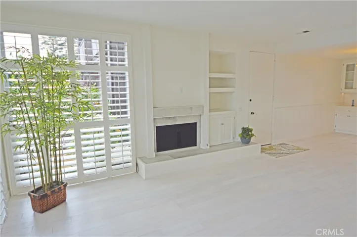Custom top quality wood shutters grace the windows.