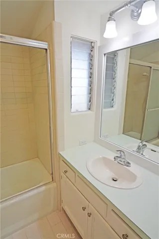 The primary bath features a shower over the tub.