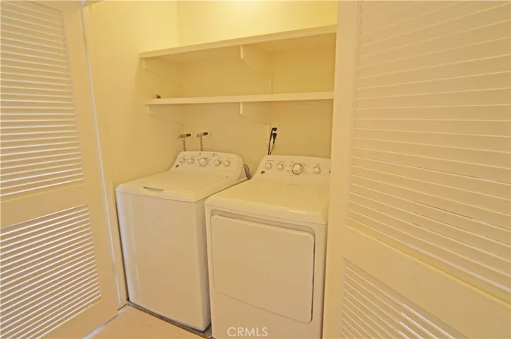 The washer and the dryer are located between the two upstairs bedrooms.