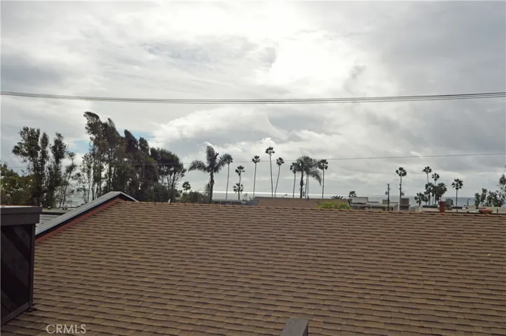 From the upstairs primary suite, there is an ocean view (this photo unfortunately was taken on a "Gray Day."