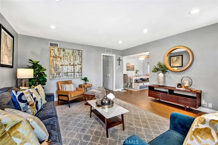 Beautiful Living Room with Recessed Lighting, Wood Laminate Flooring, Dual Pane Windows, Plantation Shutters