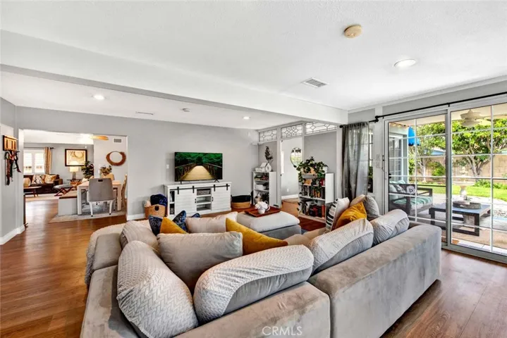 The Heart of the Home is this Family Room with Separate Office and French Sliders to Tranquil Backyard Oasis