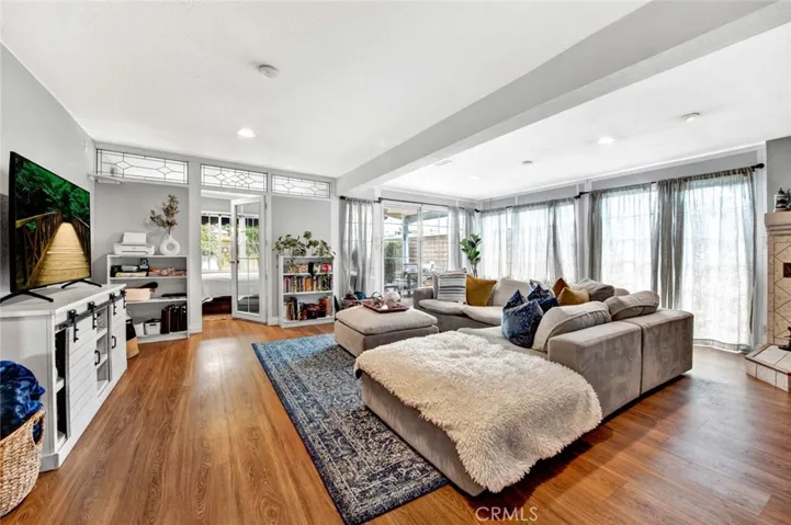 Amazing 528 SqFt Enclosed Patio that is Designed as a Huge Family Room, Plus Separate Office, with Pot-Belly Fireplace, Recessed Lighting, and Vented for Heat and A/C.