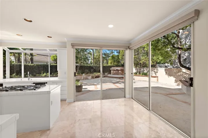 From the kitchen/family room you can enjoy the gorgeous views of the backyard/patio.  These windows are enhanced with custom remote blinds