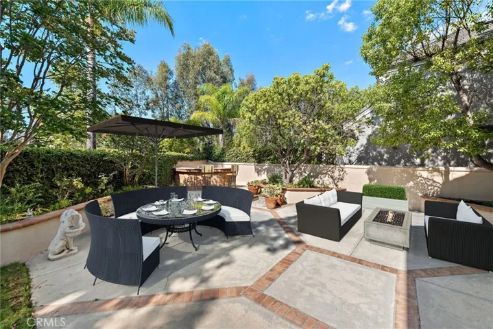 Whether dining el fresco or entertaining, this patio has plenty of space and privacy (virtual staging)