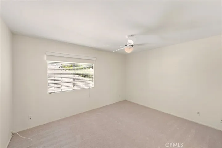 One of two secondary bedrooms that share a Jack and Jill bathroom
