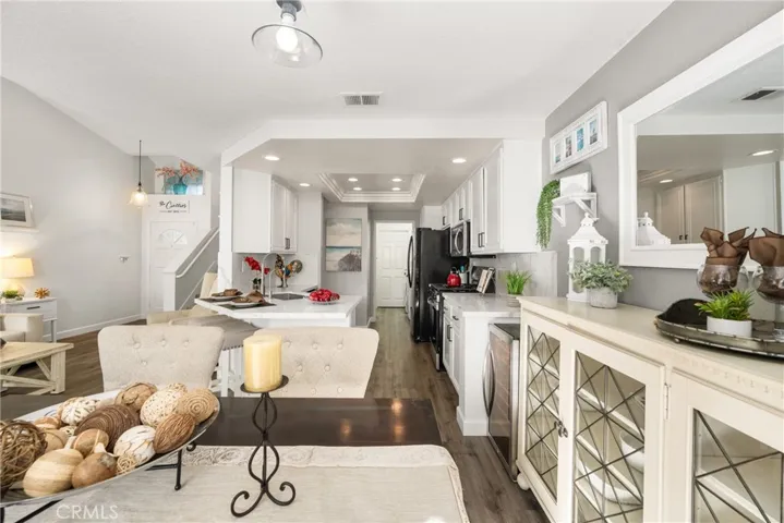 Just pass the kitchen you'll find the separate laundry room and direct access to your garage.