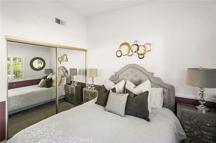 Vaulted ceilings & mirrored wardrobes add a sense of spaciousness to the room!