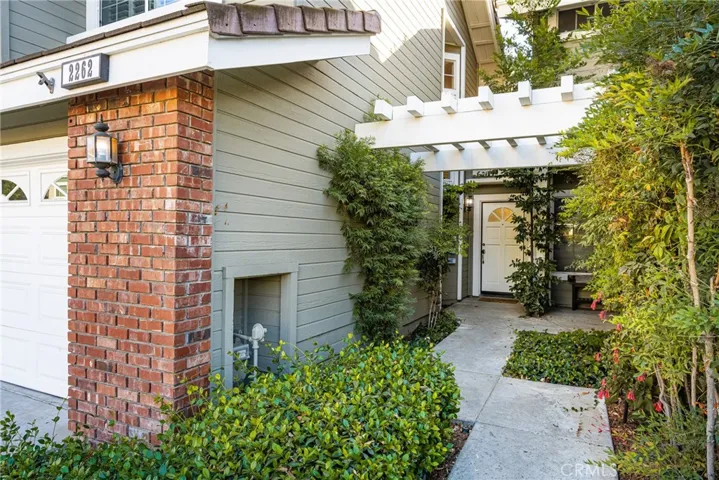 Lots of greenery spruces up the sidewalk to the front door!
