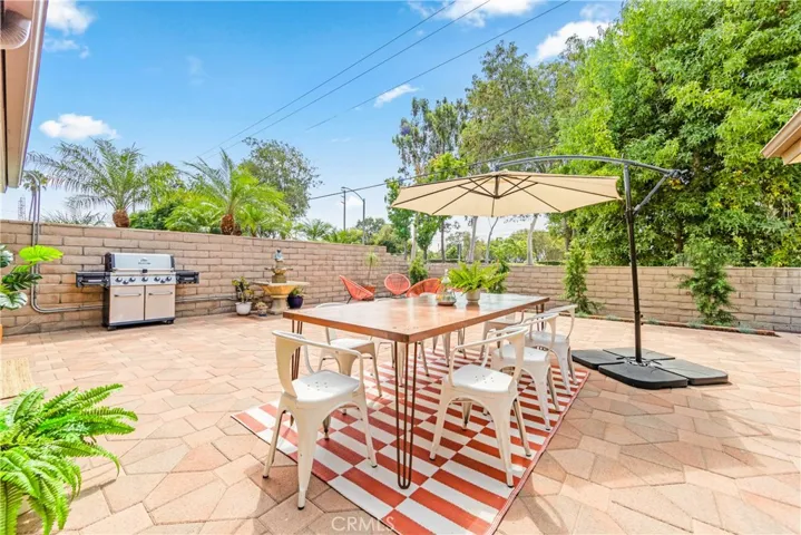 Massive, paved side courtyard fully enclosed by the stacked block walls