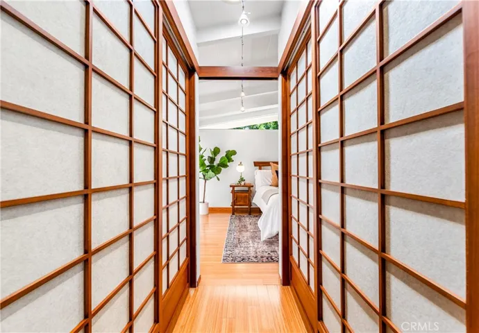 Leading into the primary room with Shoji closets