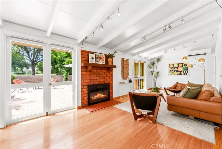 Looking through the ceiling to floor windows and doors onto the side patio/courtyard.