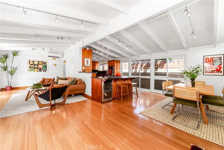 Beautiful beamed ceiling Cliff May design! Look at those gorgeous bamboo floors!