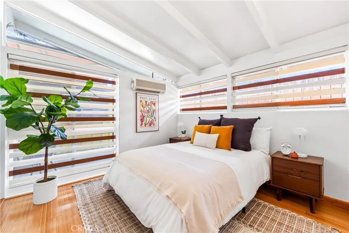 One of the three bedrooms with it's own mini split and gorgeous floors
