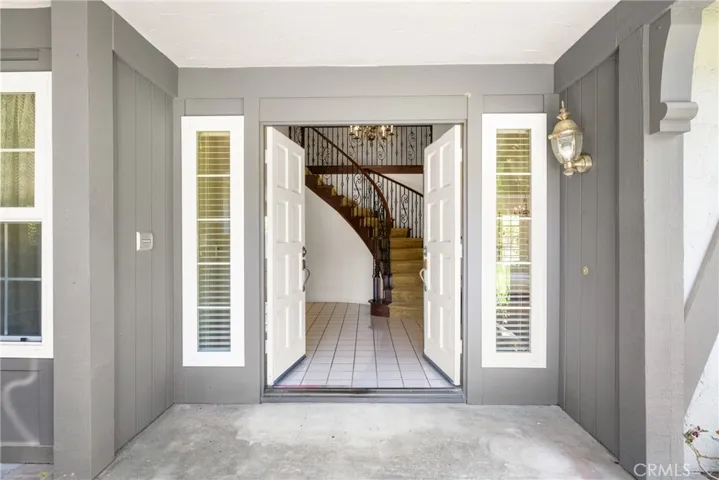 Luxury Double Door Entry with Upgraded Wrought Iron Staircase