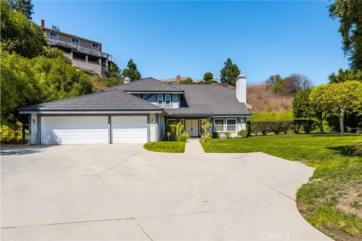 Large Area for Turnaround and Front View of the Home with its Newer Garage Doors