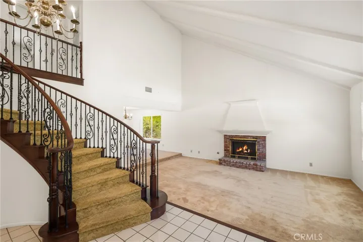 Firelit Formal Living Room with Vaulted Ceilings