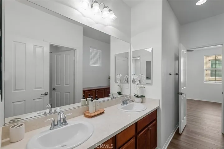 upstairs bathroom with dual sinks