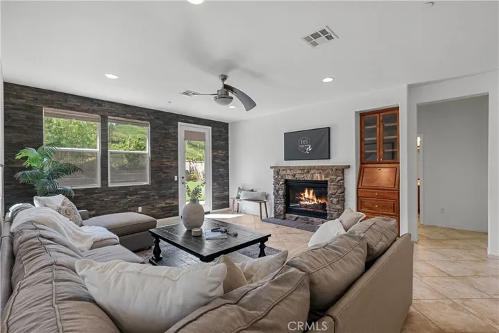 living room with fireplace and door to yard