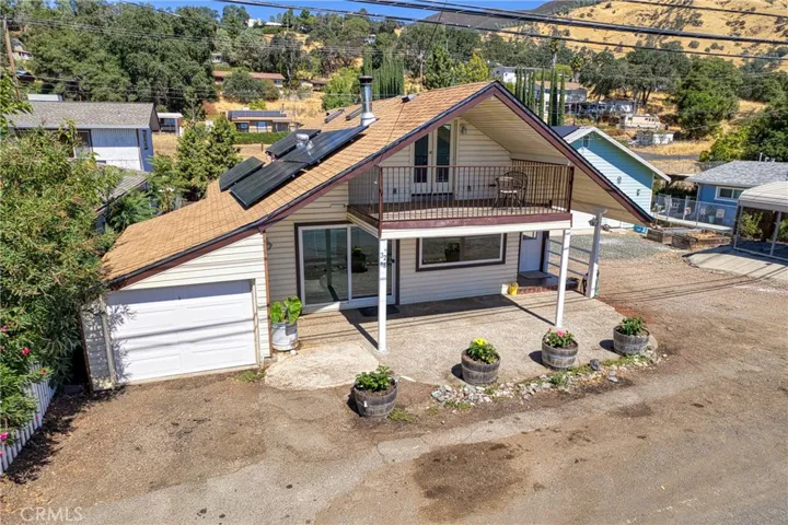 One car garage in front of house. Back of house has 2 car garage.