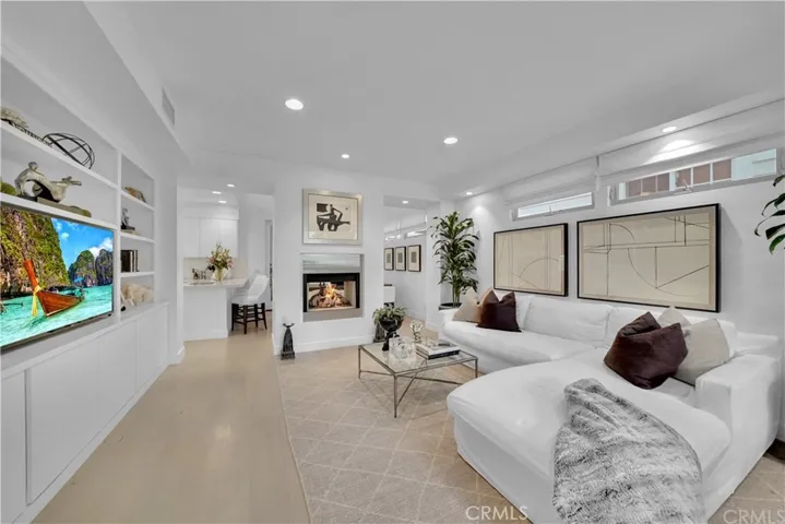 Living room with fireplace & dining area